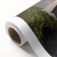 Rolled canvas artwork depicting a stunning landscape with a majestic castle, showcasing vibrant colors and intricate details, elegantly packaged in a protective tube for art enthusiasts.