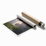 Rolled print showcasing a vibrant landscape featuring a majestic castle set against a serene backdrop of lush greenery and a clear blue sky, perfect for home decor.