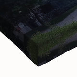 Close-up of a stretched canvas print showcasing a vibrant landscape with a majestic castle surrounded by lush greenery, ideal for home decor enthusiasts.