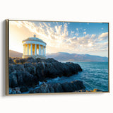 Framed canvas artwork depicting a stunning coastal landscape with cliffs and a golden frame, enhancing the serene ocean view, ideal for elegant home decor.