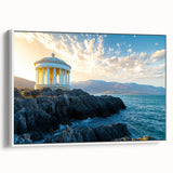 Framed canvas artwork depicting a scenic landscape of dramatic cliffs, showcasing vibrant colors and intricate details, with a sleek white frame for a modern touch.