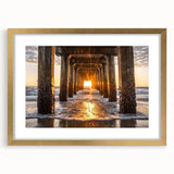 Framed landscape artwork depicting serene beach scene with soft golden matting, ideal for coastal home décor; enhances tranquility and elegance in any room.