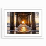 Framed landscape artwork depicting serene beaches with gentle waves, featuring a white mat and sleek frame, perfect for coastal decor enthusiasts.