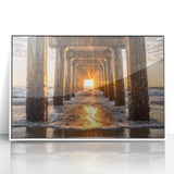 Framed acrylic wall art depicting a serene beach landscape with vibrant blue skies and gentle waves, set in a sleek white frame for a modern decor touch.