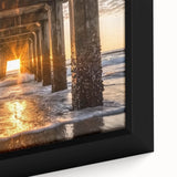 Close-up of a framed canvas artwork depicting a serene beach landscape with soft pastel colors, ideal for home decor, evoking relaxation and tranquility.