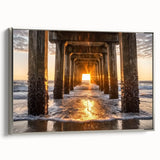 Framed canvas artwork showcasing a serene beach landscape with soft waves and sandy shores, accentuated by a sleek silver frame, ideal for coastal decor.