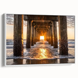 Framed canvas artwork depicting a serene beach landscape, showcasing soft pastel colors of the sky and ocean, with a sleek white frame enhancing its elegance. Perfect for coastal-themed home decor.