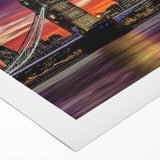 Rolled canvas artwork depicting a serene landscape bridge scene, showcasing vibrant colors and intricate details, securely packaged in a protective cardboard tube for shipping.