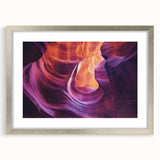 Framed landscape artwork depicting vibrant canyons in rich colors, featuring a silver mat and sleek frame, perfect for enhancing modern home decor.