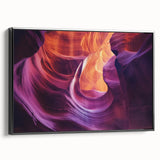 Framed canvas artwork depicting a stunning landscape of canyons in rich earth tones, featuring a black frame that enhances its vibrant details, perfect for home décor.