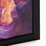 Close-up of a framed canvas depicting a stunning landscape of canyons with vibrant colors and intricate details, perfect for home decor or art enthusiasts.