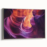 Framed canvas artwork depicting a stunning landscape of canyons in vibrant hues, featuring a sleek silver frame that enhances its modern aesthetic, ideal for home decor.