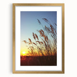 Elegant gold-framed landscape artwork depicting a serene countryside scene with lush greenery, rolling hills, and a clear blue sky, perfect for enhancing home decor.
