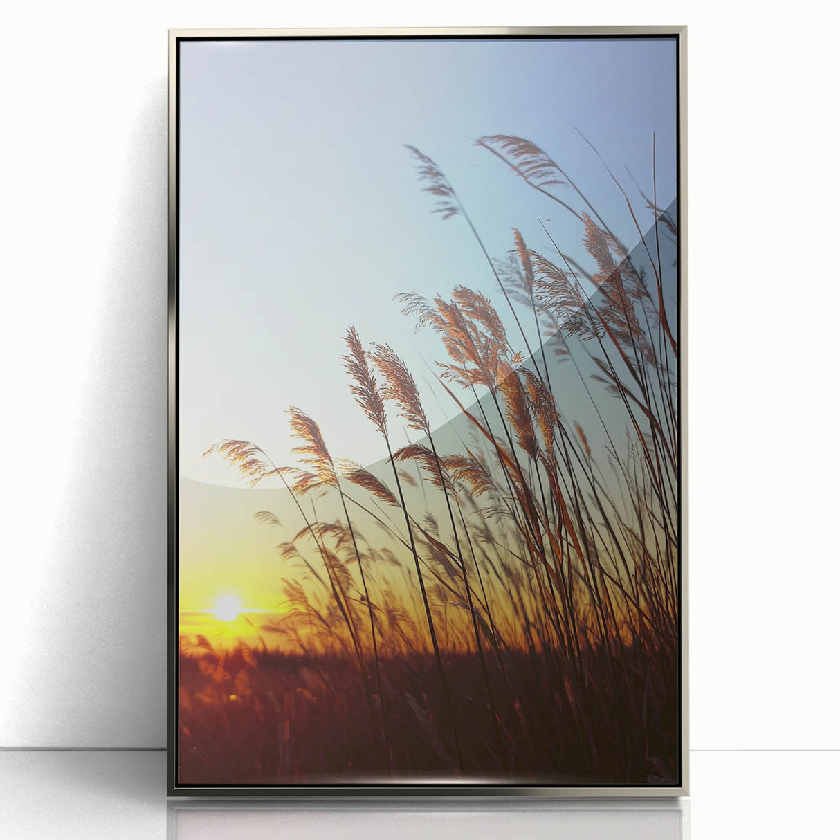 Framed acrylic artwork showcasing a serene countryside landscape, featuring lush green fields and a bright blue sky, elegantly presented in a stylish silver frame, perfect for home decor.