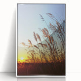 Framed acrylic landscape artwork showcasing a serene countryside view, featuring vibrant greens and blues, displayed in a sleek white frame, ideal for home decor.