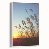 Framed canvas artwork depicting a serene countryside landscape with vibrant green fields and a clear blue sky, showcased from a white side view for elegant home decor.