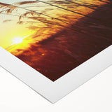 Rolled canvas print showcasing a serene countryside landscape, featuring vibrant green fields and a clear blue sky, elegantly packaged in a protective cardboard tube for safe delivery.