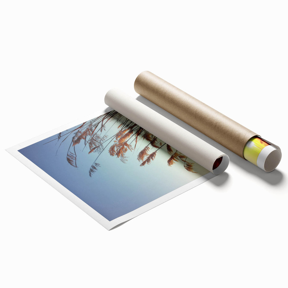 Vibrant rolled print depicting a serene countryside landscape, showcasing lush green fields under a bright blue sky, perfect for home decor.