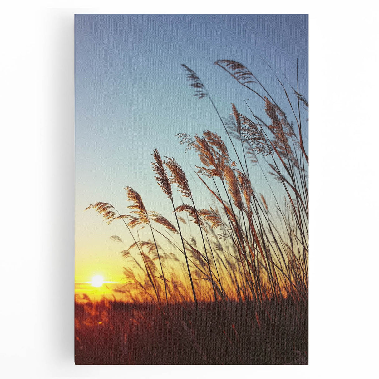 Stretched canvas artwork depicting a serene countryside landscape with rolling hills, vibrant green fields, and a clear blue sky, perfect for home decor.