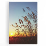 Stretched canvas artwork depicting a serene countryside landscape with rolling hills, vibrant green fields, and a clear blue sky, perfect for home decor.