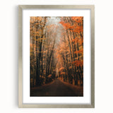 Textured abstract art print in warm autumn hues on a silver-framed canvas, ideal for bedroom decor.