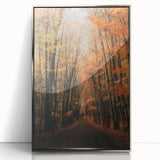 Mid-century modernist art depicting autumn trees in warm orange tones, framed in silver acrylic.