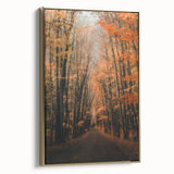 Framed canvas featuring a vintage landscape painting of an autumnal scene with muted gold and black tones.