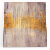 Abstract wall art featuring vibrant strokes in shades of blue, orange, and yellow on a stretched canvas, leaning against a neutral wall, ideal for modern decor.