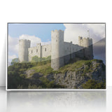 Framed acrylic landscape artwork showcasing a majestic castle surrounded by lush greenery, featuring a white frame that enhances its elegance. Perfect for home decor.