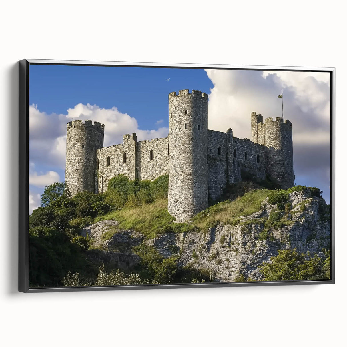 Framed canvas artwork showcasing a picturesque landscape with a majestic castle, elegantly displayed in a black frame, enhancing any interior decor. Perfect for adding a touch of sophistication to living spaces.