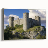 Framed canvas artwork showcasing a stunning landscape with a castle, featuring a silver frame and side view, perfect for home decor enthusiasts.