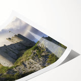 Scenic landscape print showcasing a majestic castle surrounded by lush greenery, rolled for shipping in a protective tube, perfect for home decor.