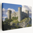 Stretched canvas artwork showcasing a picturesque landscape featuring a majestic castle, surrounded by lush greenery and vibrant skies, perfect for home decor.