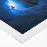 Rolled canvas artwork showcasing a stunning landscape scene with vibrant colors and intricate cave details, securely packaged in a protective cardboard tube for shipping. Perfect for home decor enthusiasts seeking unique art pieces.