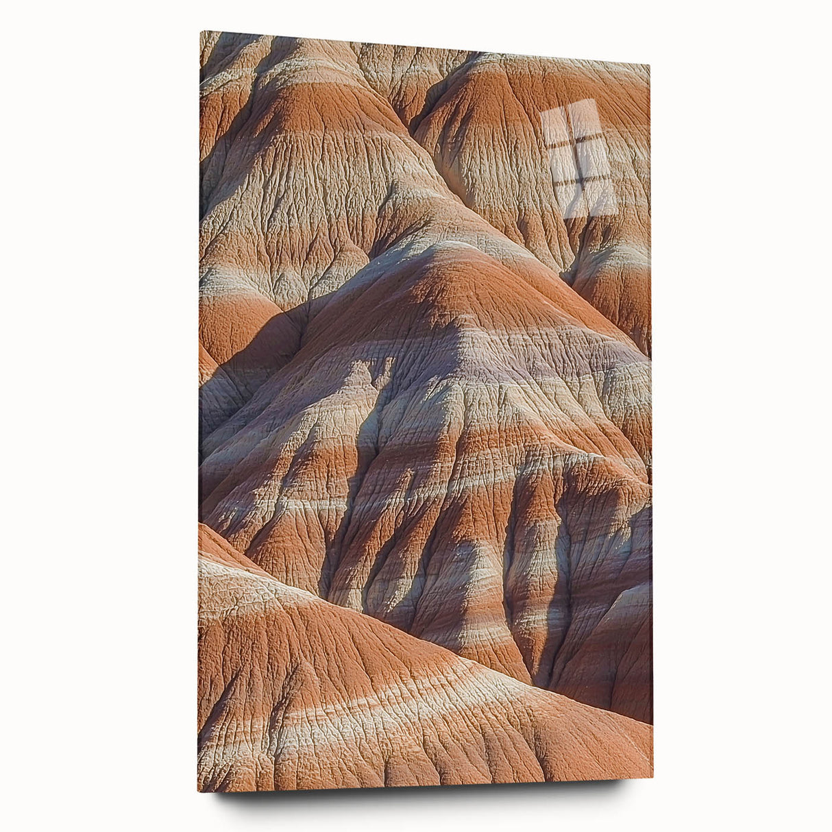 Acrylic landscape artwork showcasing dramatic cliffs in vibrant colors, displayed in a sleek glass frame, emphasizing depth and detail for modern decor.