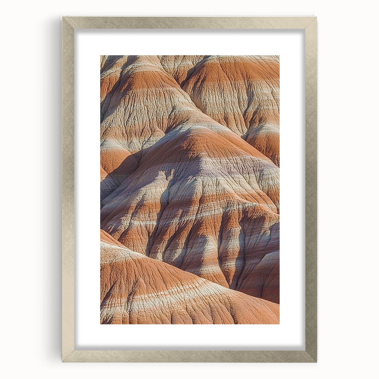 Framed landscape artwork depicting dramatic cliffs in a natural setting, featuring a sleek silver mat and frame, ideal for enhancing modern home decor aesthetics.