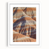 Framed landscape artwork showcasing dramatic cliffs in a serene setting, featuring a white mat for an elegant finish, ideal for home decor enhancement.
