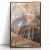 Framed acrylic artwork depicting a stunning landscape of cliffs under a vibrant sunset, featuring gold accents that enhance its elegance, perfect for modern decor.