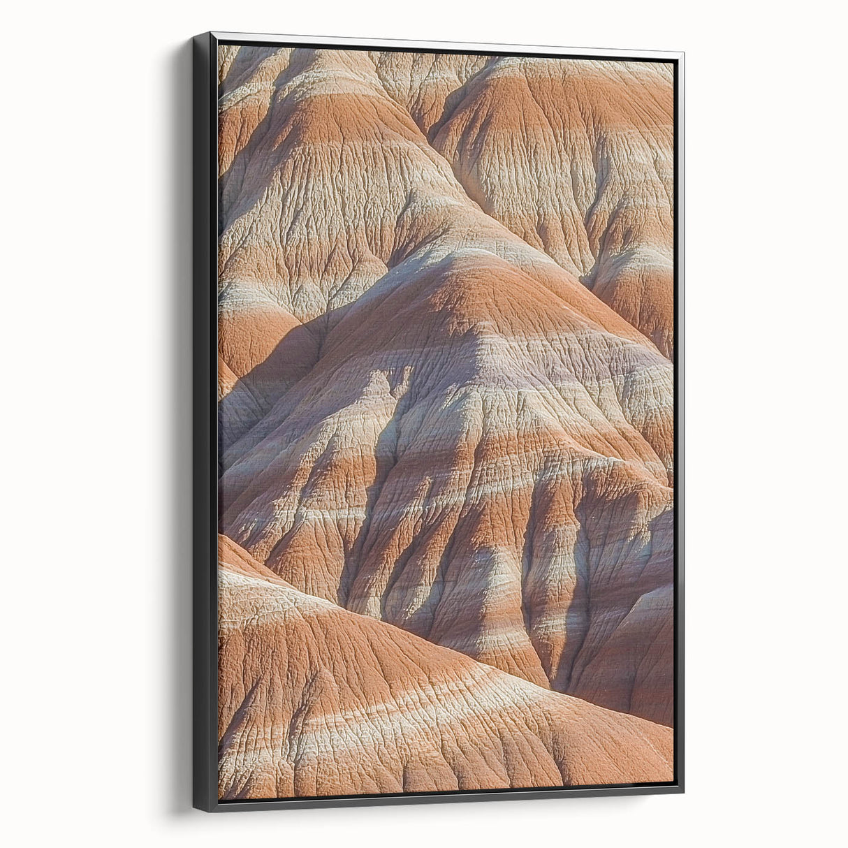 Framed canvas artwork depicting a stunning cliffside landscape, featuring rich colors and intricate details, set against a sleek black frame for modern decor.