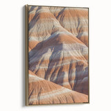 Framed canvas artwork depicting a stunning landscape of cliffs with vibrant colors and intricate details, showcasing a gold frame that enhances the overall elegance. Perfect for home or office decor, this piece adds a touch of sophistication to any space.