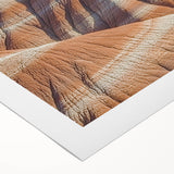 Vibrant rolled canvas artwork depicting stunning cliffs under a blue sky, showcasing intricate details and rich colors, perfect for landscape decor enthusiasts.