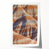 Vibrant landscape print showcasing majestic cliffs under a clear blue sky, rolled and carefully packaged in a protective tube, perfect for home decor.