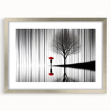 Abstract figurative wall art framed in a sleek silver design, showcasing a vibrant mix of colors and shapes, perfect for modern home decor.