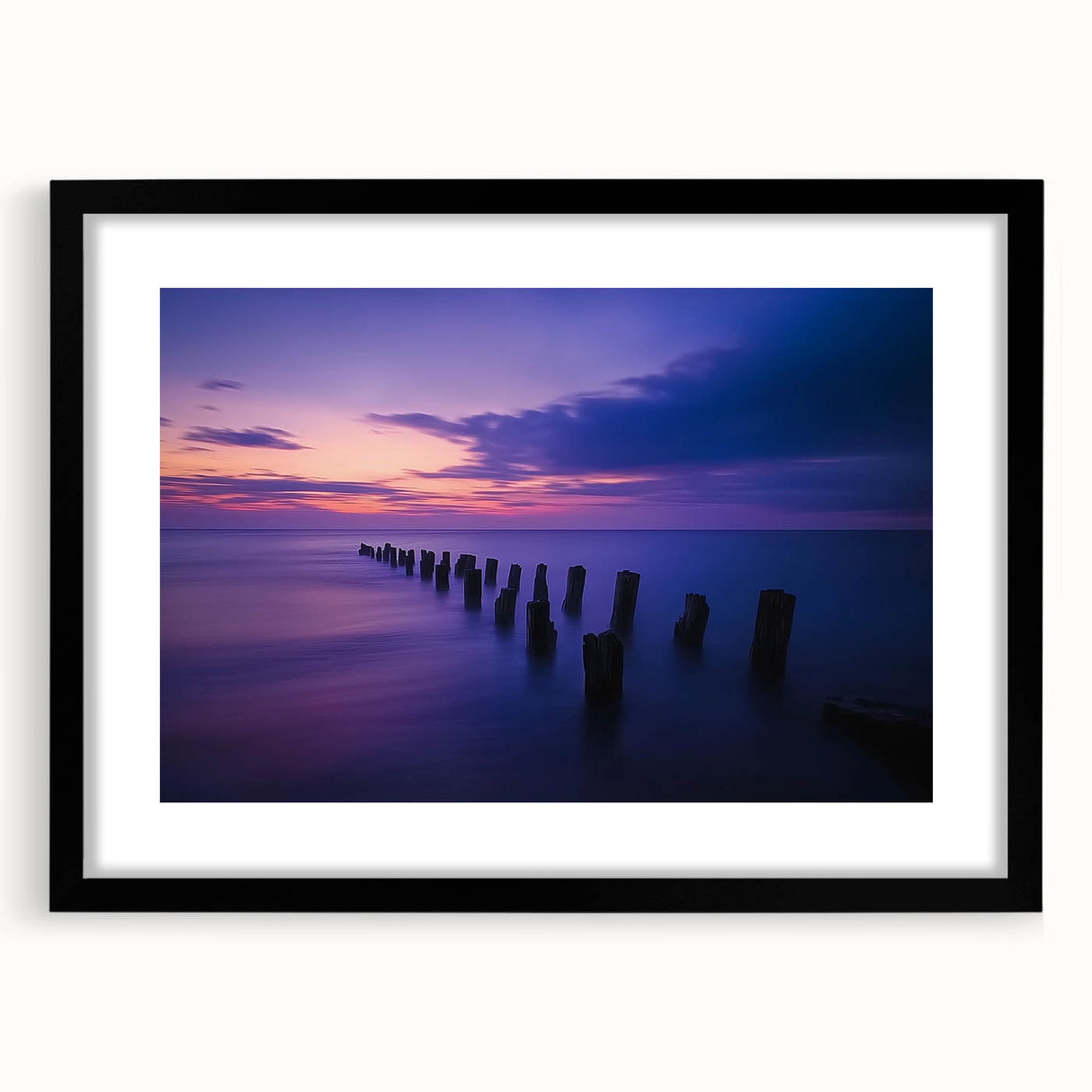 Framed landscape artwork showcasing a serene beach scene with vibrant colors, enclosed in a sleek black mat and frame, perfect for home decor enhancement.