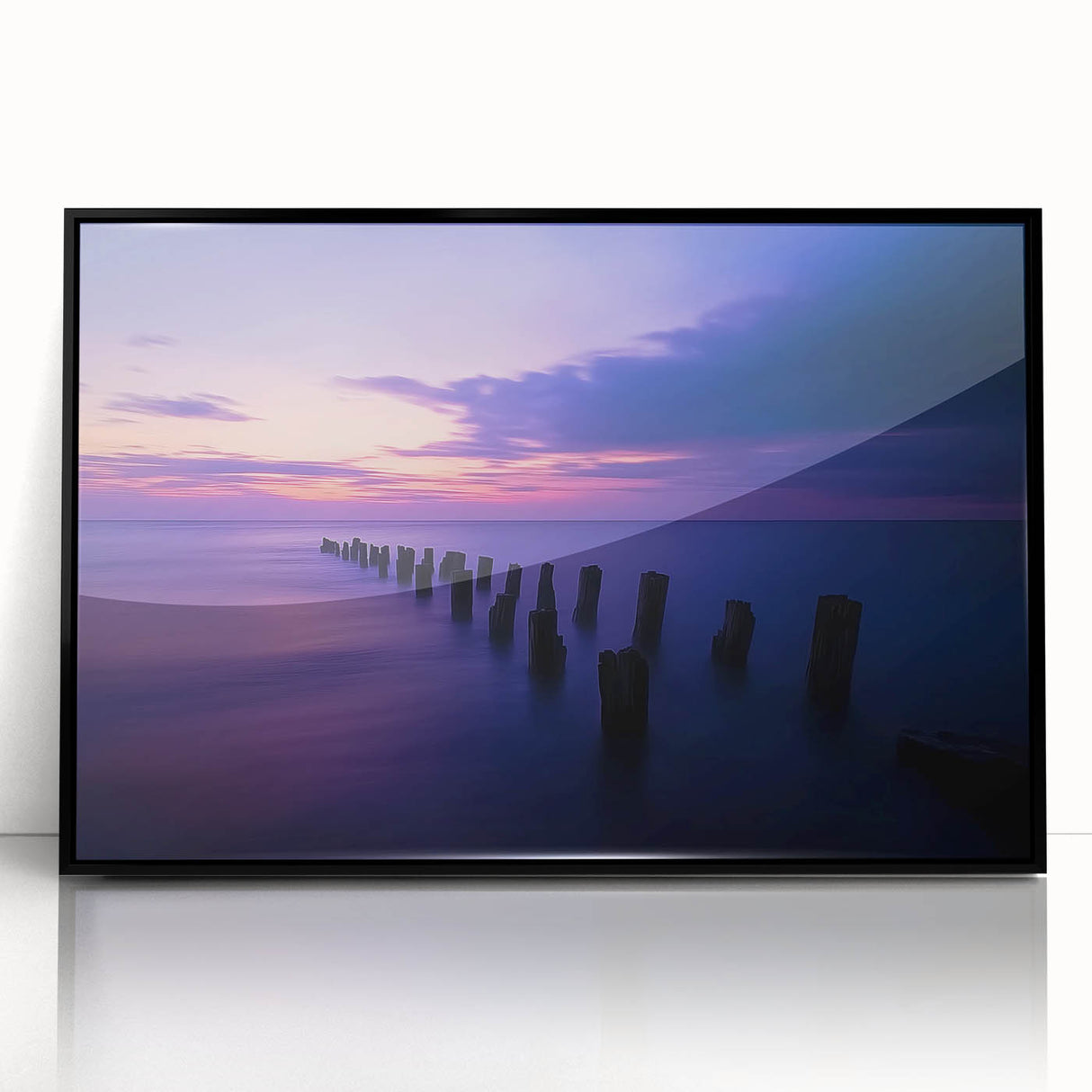 Framed acrylic artwork showcasing a serene beach landscape, featuring vibrant colors and fine details, set in a sleek black frame, perfect for coastal decor.