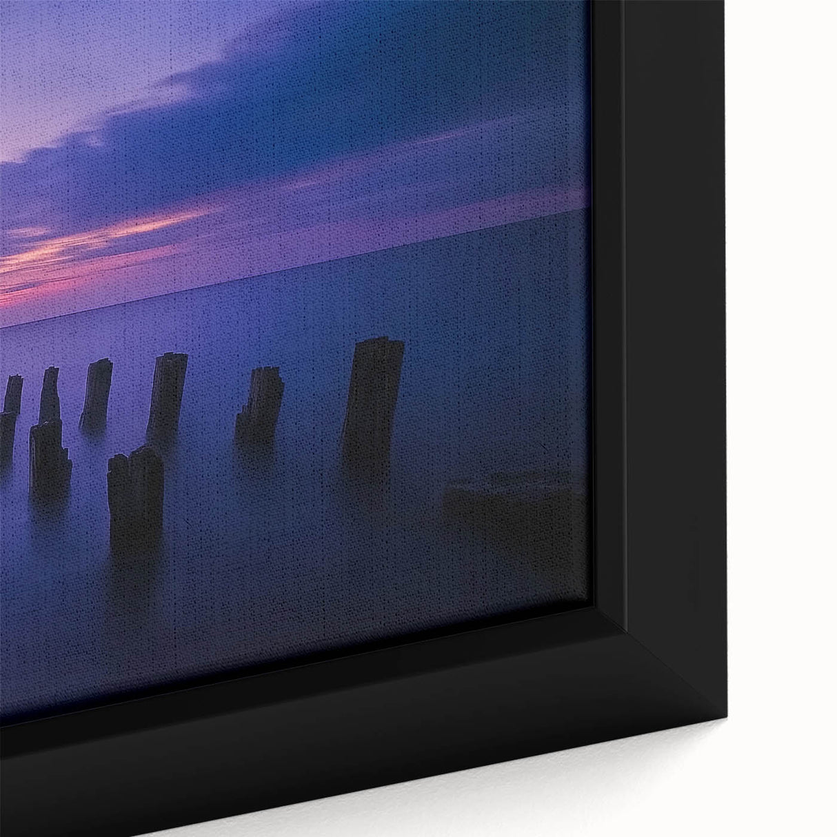Framed canvas artwork showcasing a vibrant beach landscape with vivid blues and greens, highlighting the gentle waves and golden sands, perfect for coastal home decor.