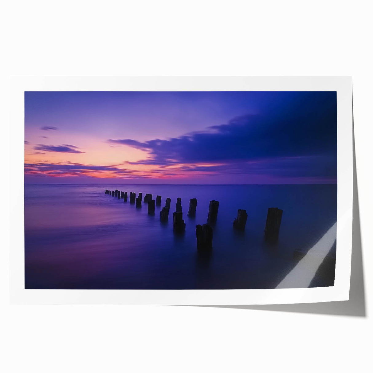 Serene landscape print showcasing a tranquil beach scene with soft waves and sandy shores, rolled in a protective tube, perfect for home decor or art collections.