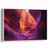 Framed canvas artwork depicting a stunning landscape of canyons with vibrant colors, showcased in a sleek white frame, perfect for modern home decor.