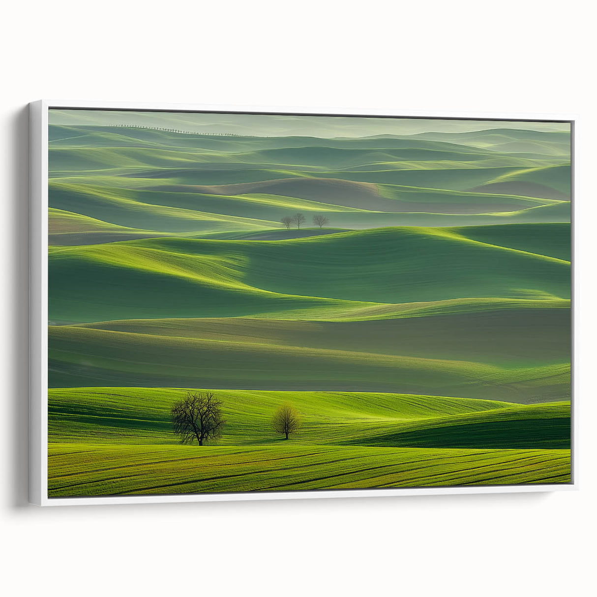 Framed canvas artwork depicting a serene countryside landscape in vibrant colors, showcasing rolling hills and lush greenery, with a sleek white frame enhancing its elegance. Perfect for home decor and nature-themed interiors.