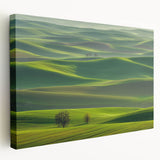 Stretched canvas artwork depicting a vibrant countryside landscape with rolling hills and a clear blue sky, showcasing rich greens and earthy tones. Perfect for home decor.